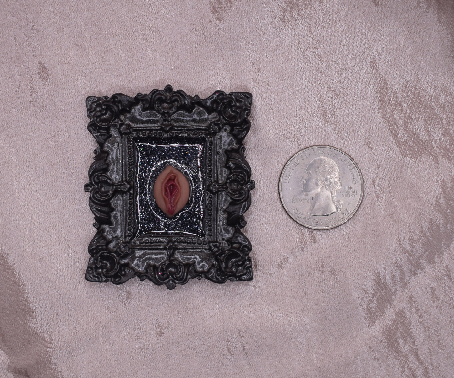 Ornate black vagina frame
