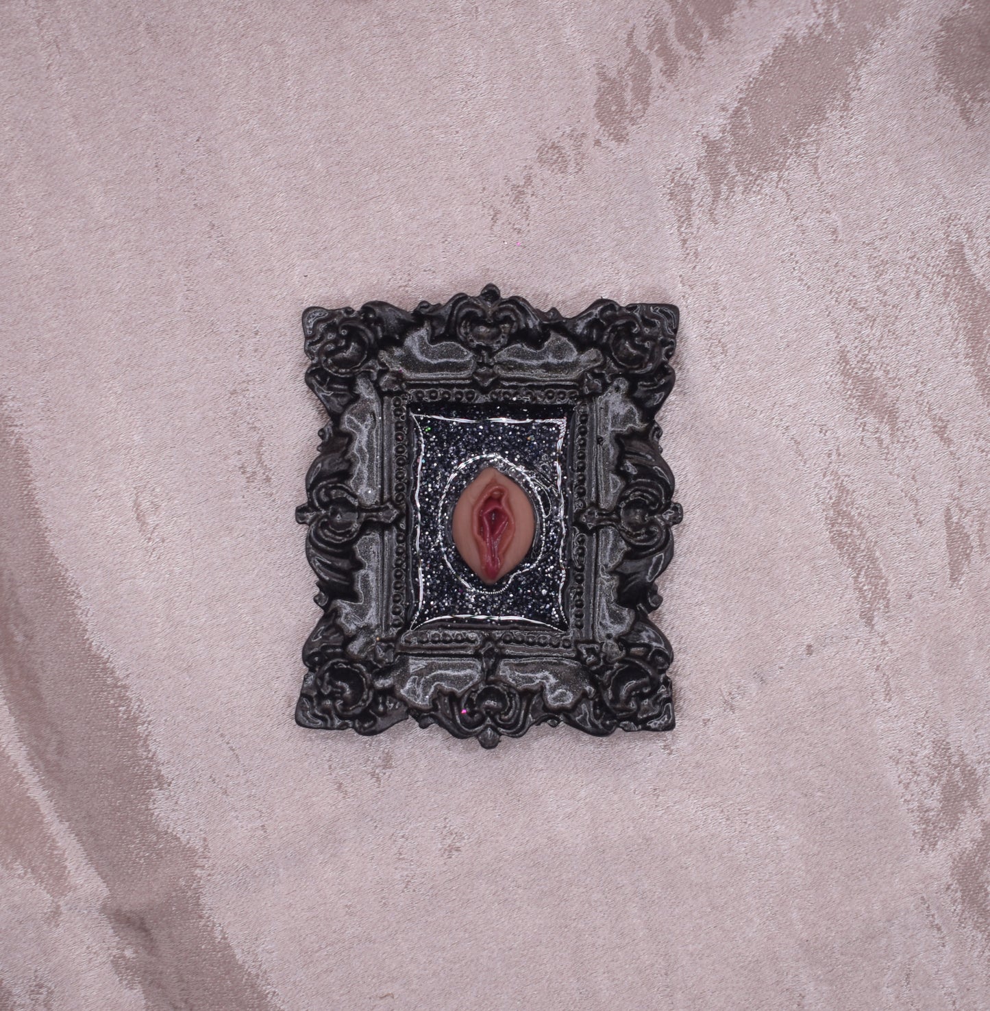 Ornate black vagina frame