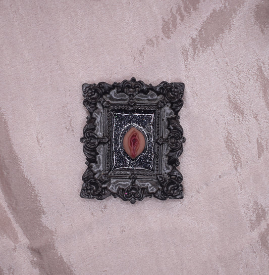 Ornate black vagina frame