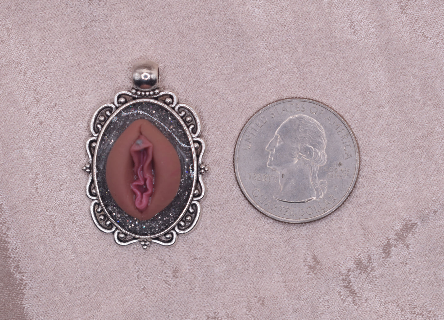 Silver pierced vagina pendant