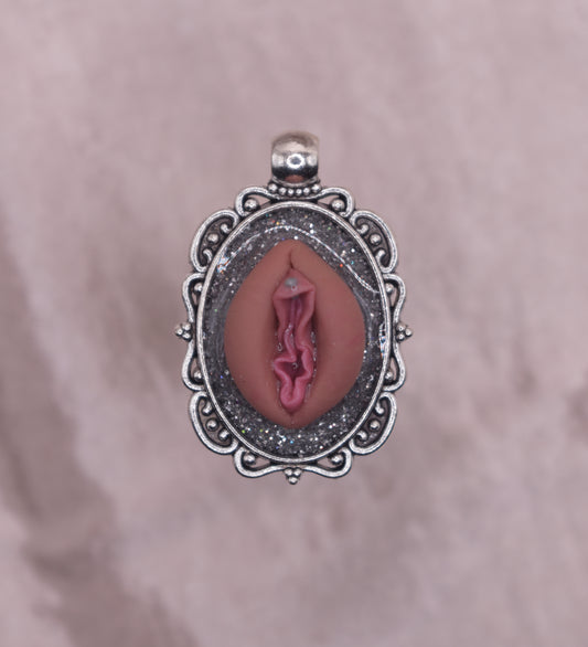 Silver pierced vagina pendant
